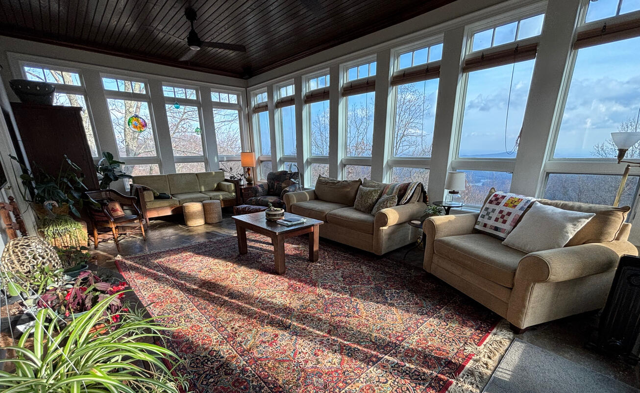 Mission: Warm welcoming family/guest seating in Lg sunroom & I can only utilize homeowners furniture pieces. Homeowners are in love with the space, even when they're not entertaining. What a view too!